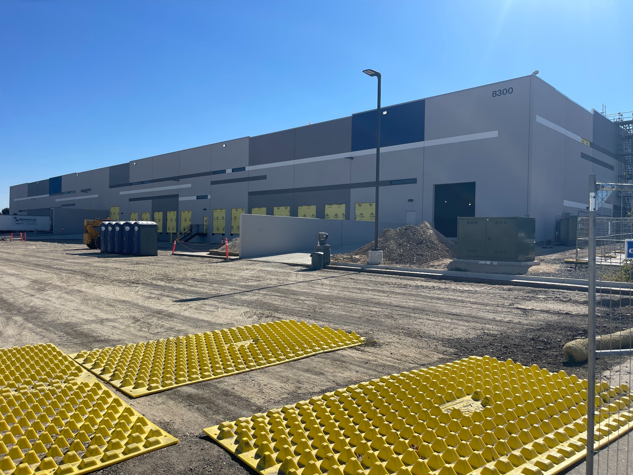 Construction activity and materials outside the Project Bedrock industrial building